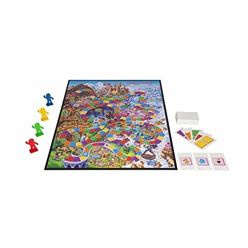 Candyland board game setup with board, cards, and colorful pieces.