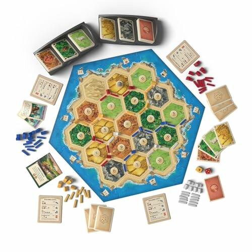 Catan board game setup with pieces and cards.