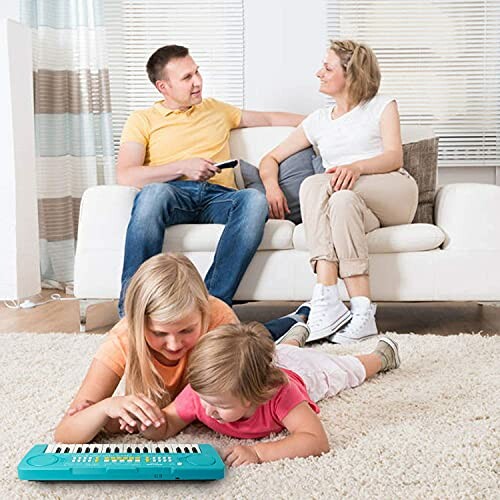 Family in living room with children playing a keyboard on the floor.