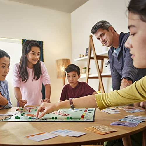 Family playing a board game together at a table, enjoying Monopoly game night.